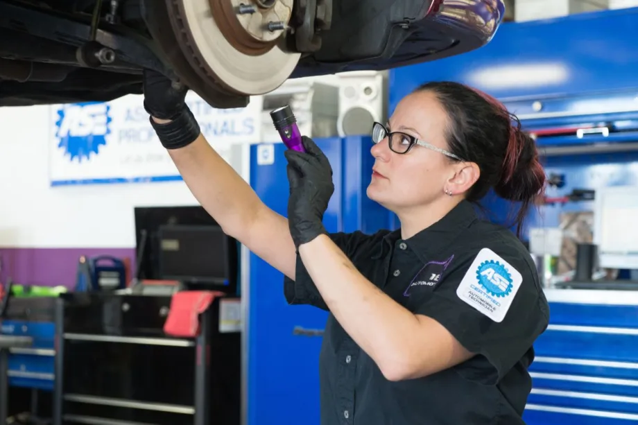 Technician working on a vehicle