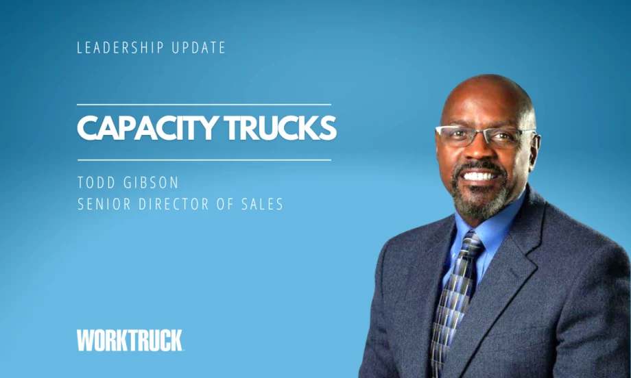 Man in business attire in front of a blue background with white headline Leadership Update and Capacity Trucks, plus a logo for Work Truck.