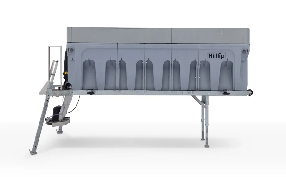 Photo of a spreader, large box-like bin that fits on the back of a truck.