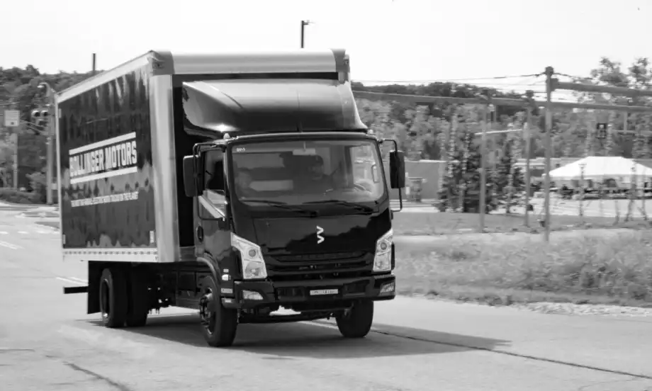 black box truck driving on road