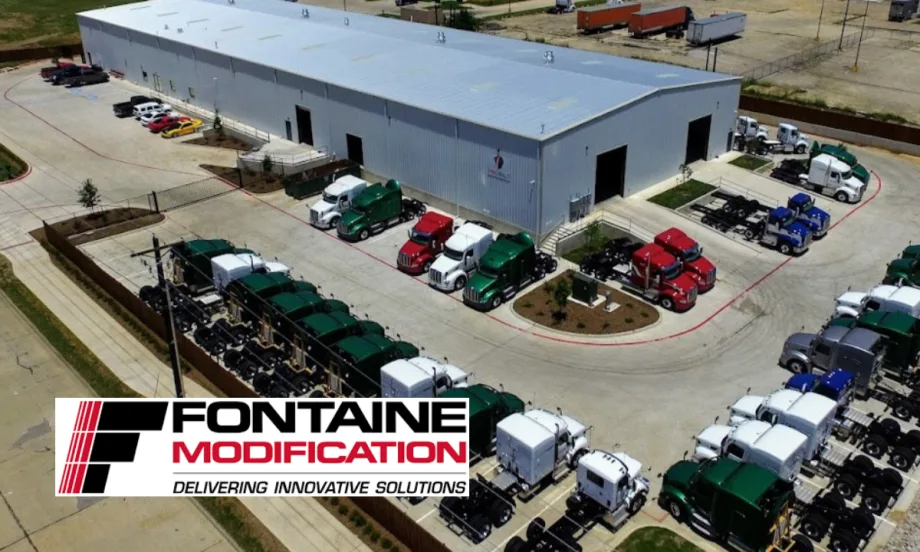 Aerial photo of a truck modification garage and trucks in the parking lot.