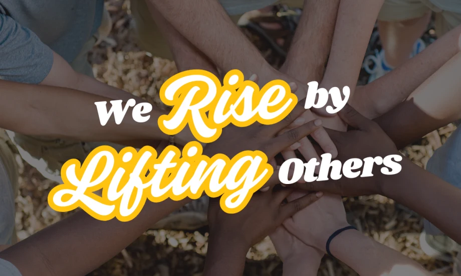 We Rise by Lifting Others with united hands in the background