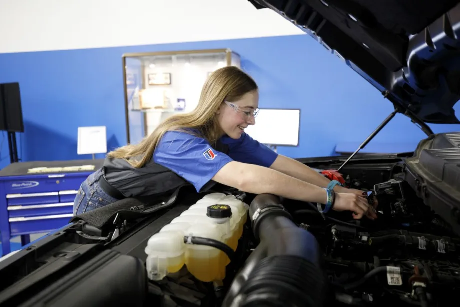 Makenna Enga working on a vehicle