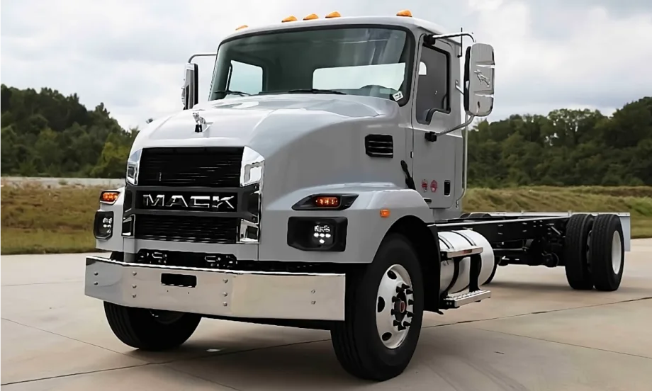 Gray chassis cab Mack truck parked.