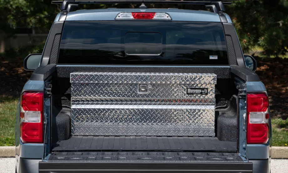 Photo of a tool box installed in the rear of a compact pickup truck, as viewed form rear with tailgate down.