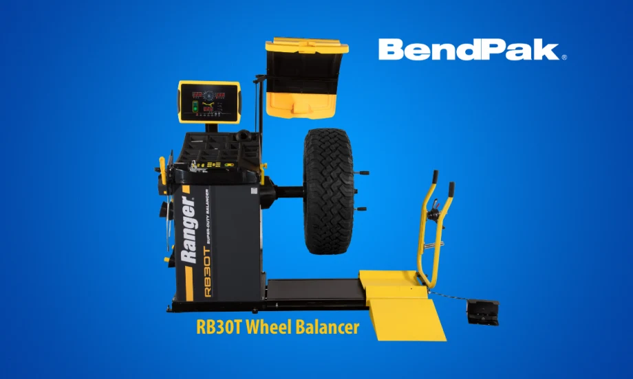Tire balancing machine against a blue background with logo for BendPak and a small headline that says RB30T Wheel Balancer.