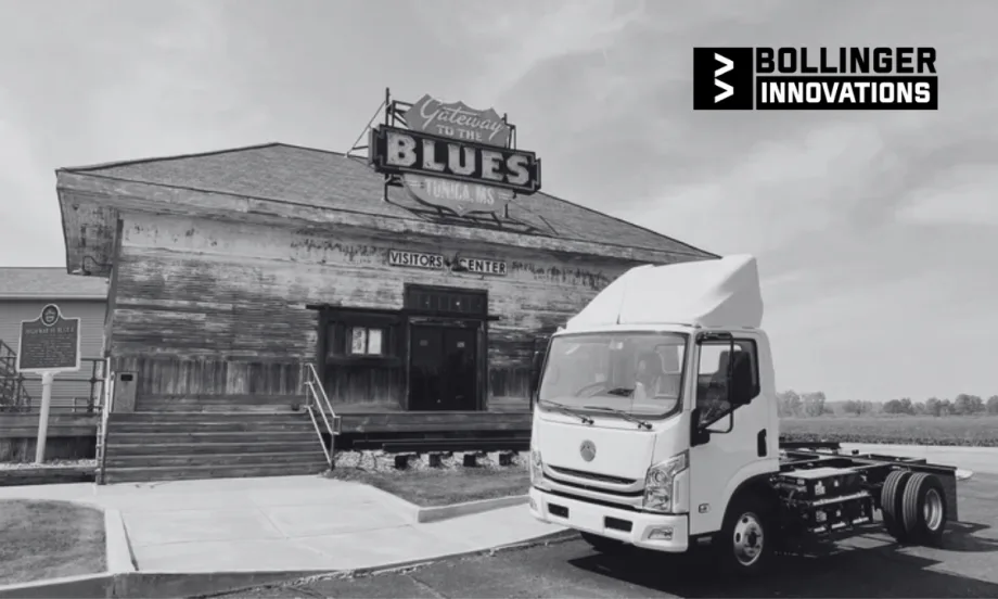 Bollinger Innovations electric cab chassis truck parked outside the Gateway to the Blues Visitors Center in Tunica, Mississippi, with the historic sign and building in the background.