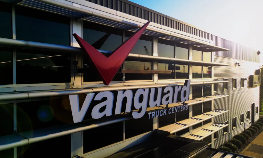 Exterior view of an industrial-looking building with signage for Vanguard.