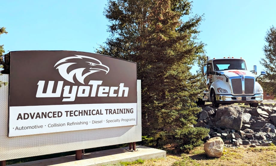 Photo of WyoTech training school sight at left and a Kenworth truck parked in the background to the right.