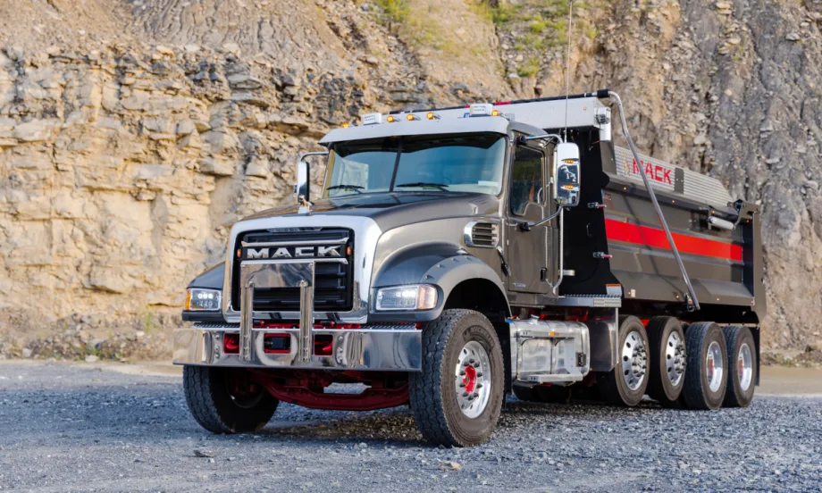 Mack dump  truck in a quarry setting.