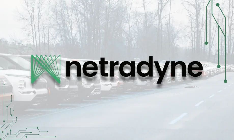 The Netradyne logo displayed over a faded background of parked fleet vehicles, with circuit-style graphics framing the corners to emphasize technology and connectivity.