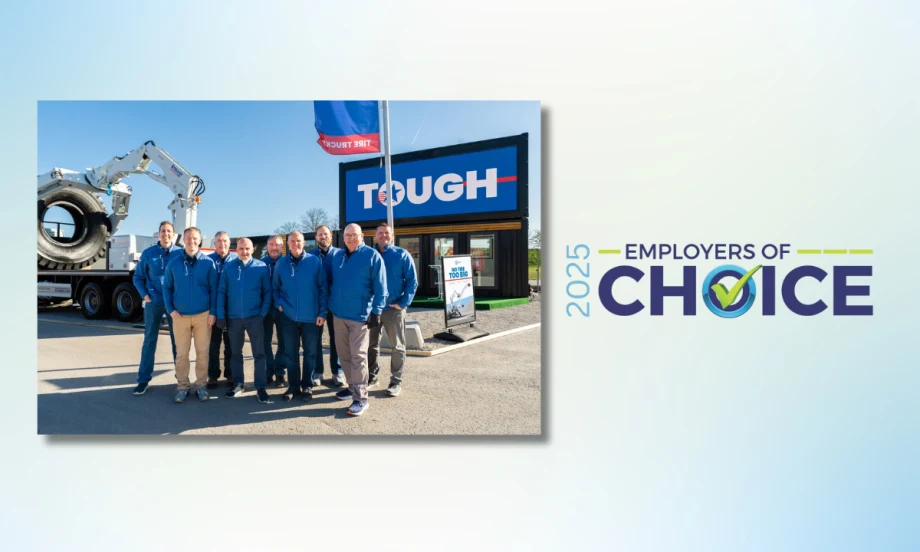A group of Stellar employees in blue jackets stand in front of company signage and equipment, celebrating the 2025 Employer of Choice award.