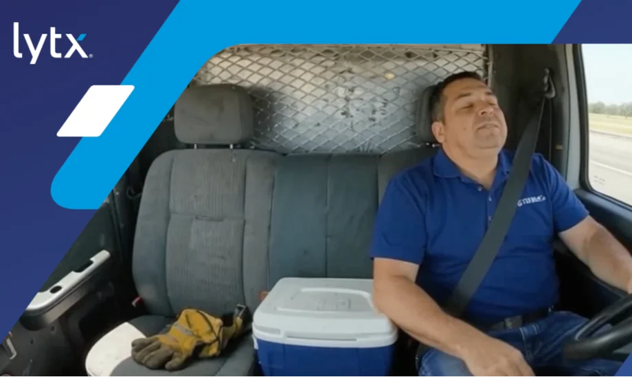 Truck driver asleep at the wheel, with logo for Lytx in the upper left corner.