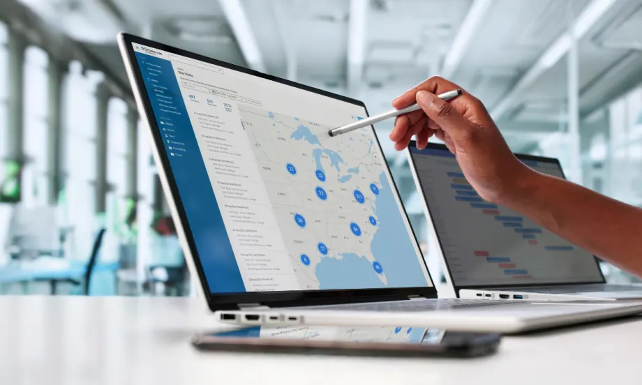 Drivewyze Safety+ Site Visits Map View displayed on a laptop, showing U.S. fleet safety events and hotspots for managers to monitor risks and driver activity.