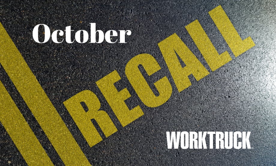 Pavement background with double yellow lines and large text that says Recall, October, and Work Truck logo.