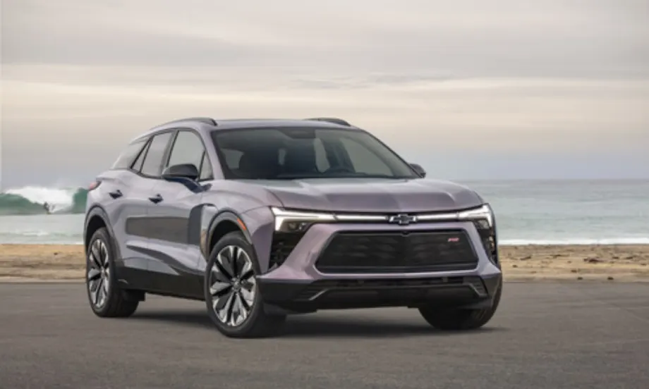 Front view of a silver Chevrolet Blazer EV parked near the ocean, named the most affordable EV to insure by Mercury Insurance.