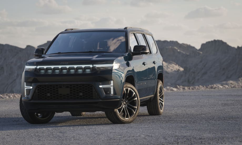 Front view of the 2026 Jeep Grand Wagoneer with illuminated grille and LED lighting.