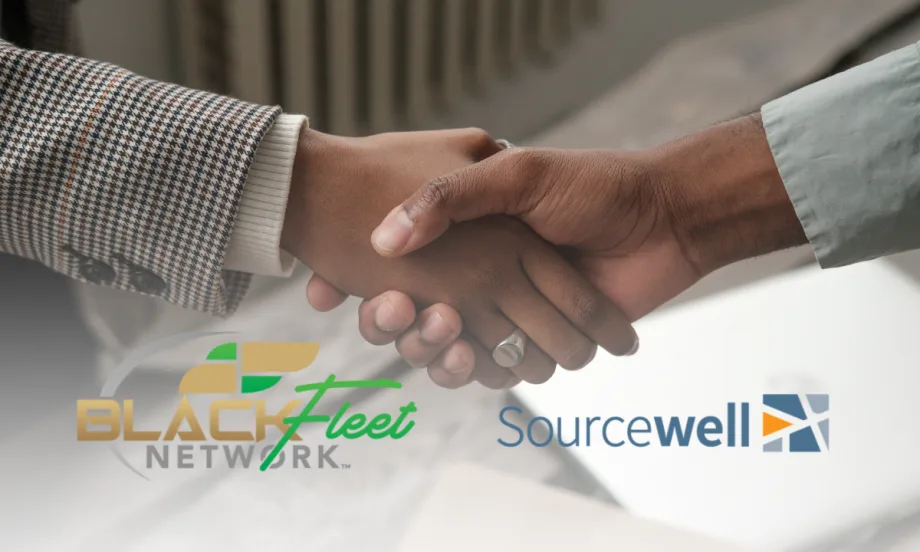 Two people shake hands representing a new partnership between Black Fleet Network and Sourcewell to strengthen fleet education and professional growth.
