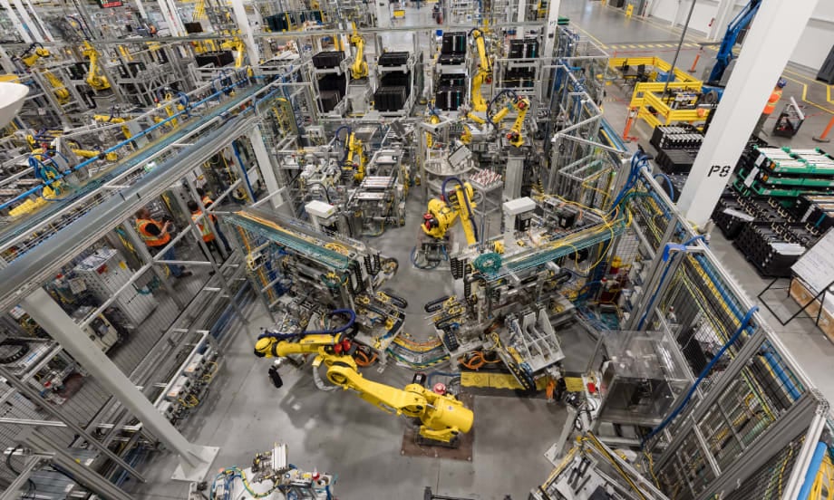 Robotic equipment operates on the production floor at GM’s CAMI Assembly plant in Ontario, where BrightDrop electric delivery vans were built before production ended.