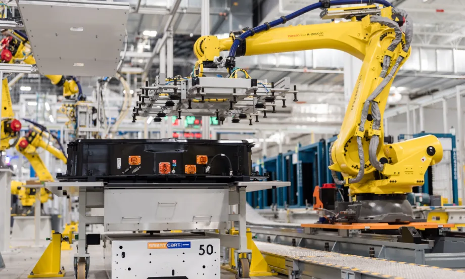 A robotic arm works on an EV battery component at a General Motors factory, reflecting the company’s ongoing adjustments to electric vehicle production capacity.