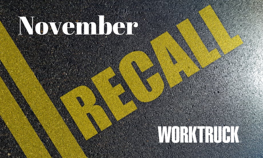 Pavement background with double yellow lines and large text that says Recall, November, and Work Truck logo.
