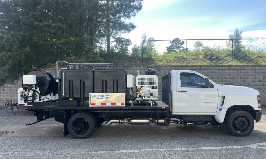 Photo of a dual hose reel mounted on the back of a work truck for sewer cleaning.