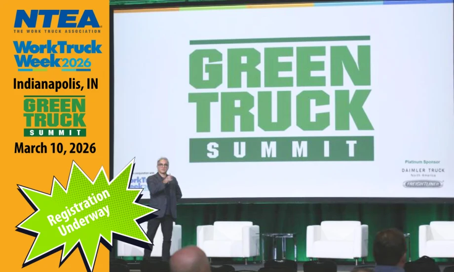 Man speaking on stage with huge screen that has Green Truck Summit logo. Left side of image has orange background and logos for NTEA, Work Truck Week, and Green Truck Summit.