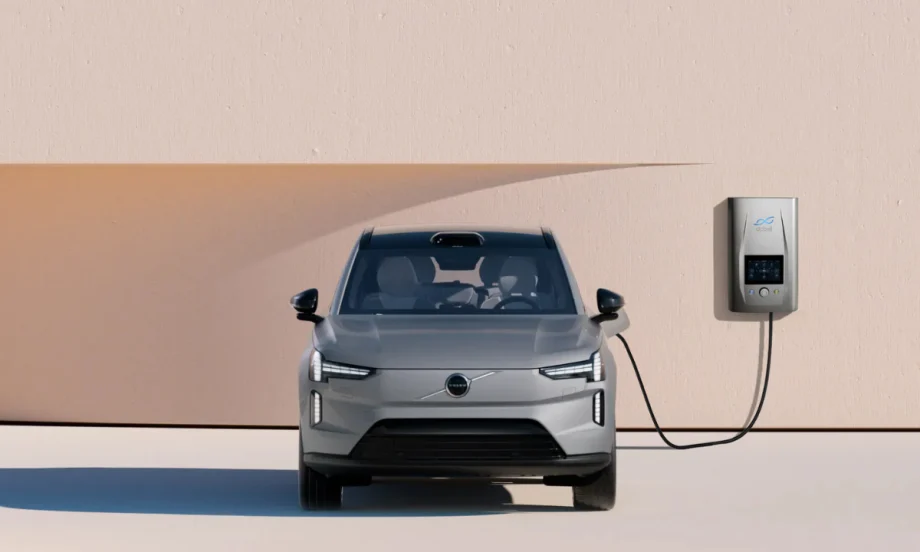 Front view of a Volvo EX90 plugged into a dcbel Ara Home Energy Station mounted on a wall.