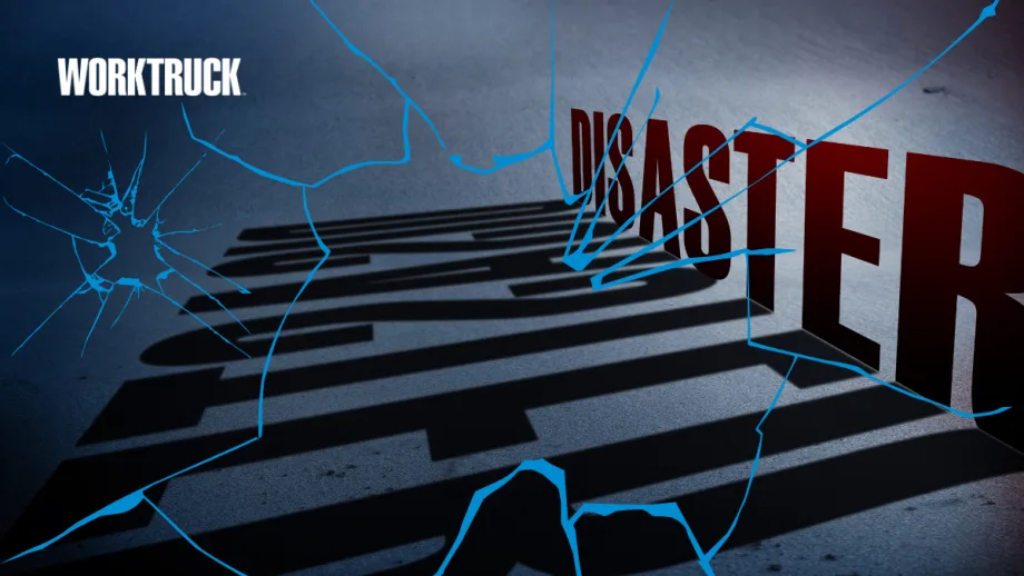 Cracked glass overlay on bold “Disaster” text casting long shadows, symbolizing how fleet operations and workflows fracture under pressure during emergency conditions