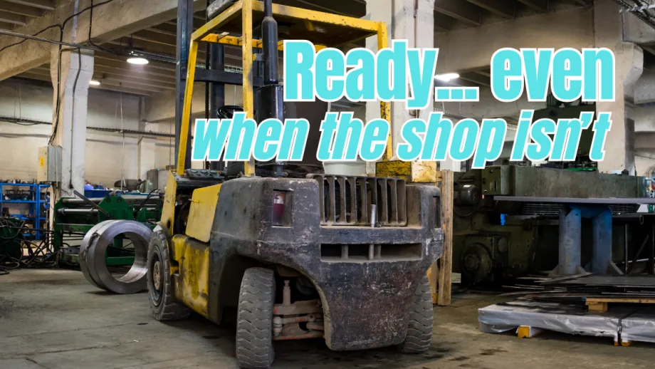 Old industrial forklift inside a workshop, showing heavy wear and tear, representing equipment maintained and used in challenging conditions.