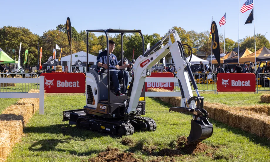 Bobcat excavator digging in the ground.