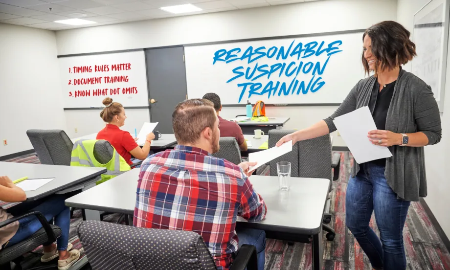 Supervisors attend DOT reasonable suspicion training in a classroom, reviewing documentation, timing rules, and practical best practices for compliance.