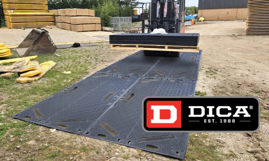Rubber mat on a construction site with a small tractor driving onto it.