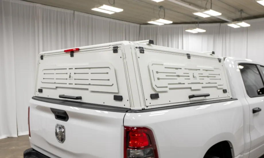 White truck cap cover installed on a white pickup truck.