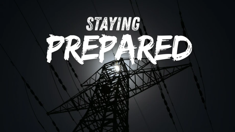 Blackout photo of a powerline with STAYING PREPARED on top