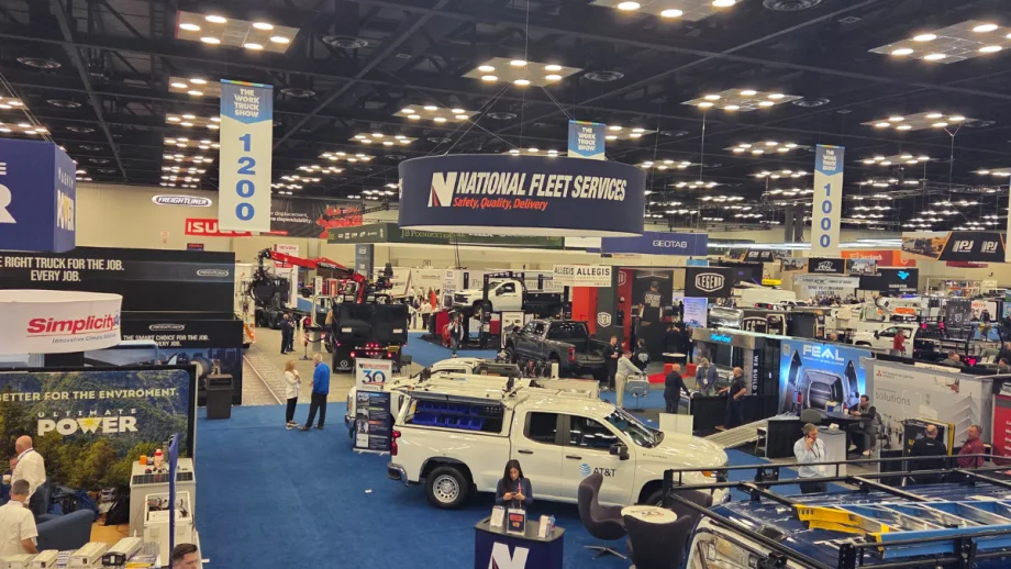 Wide view of Work Truck Week 2026 show floor with trucks, booths, and attendees exploring commercial vehicle equipment and fleet technology exhibits.