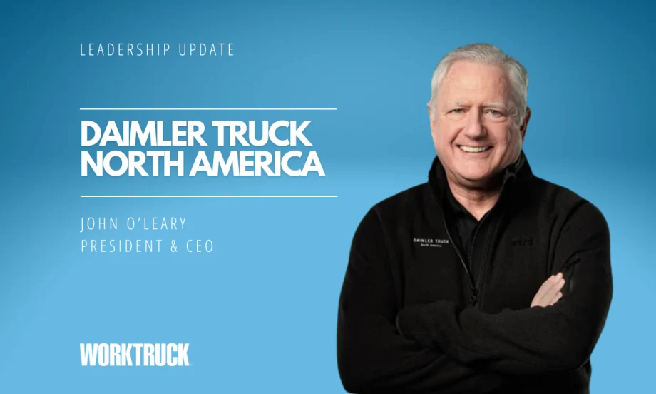 Graphic announcing a Daimler Truck North America leadership update featuring President and CEO John O’Leary smiling with arms crossed against a blue background, alongside Work Truck branding and title text.