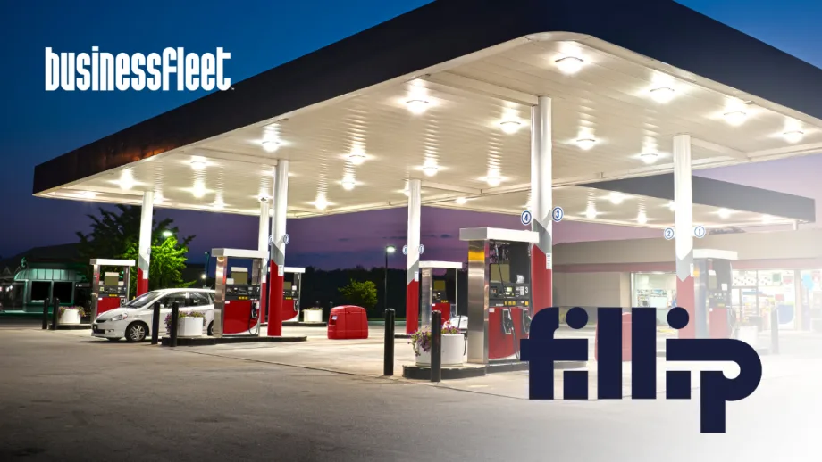Gas station canopy and fuel pumps at dusk with a passenger vehicle parked near the pumps, illustrating fuel management solutions for small business fleets.