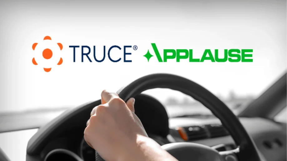 Promotional image announcing a partnership between TRUCE and Applause, featuring a driver’s hands on a steering wheel to represent connected fleet technology, driver safety, and mobile device management.