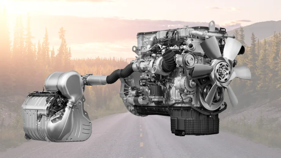 Detroit diesel engine and emissions system displayed over a scenic mountain highway at sunset, highlighting heavy-duty powertrain technology.