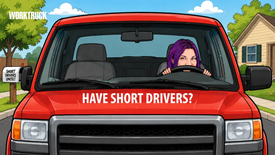 Red pickup truck wiht a shorter driver behind the wheel