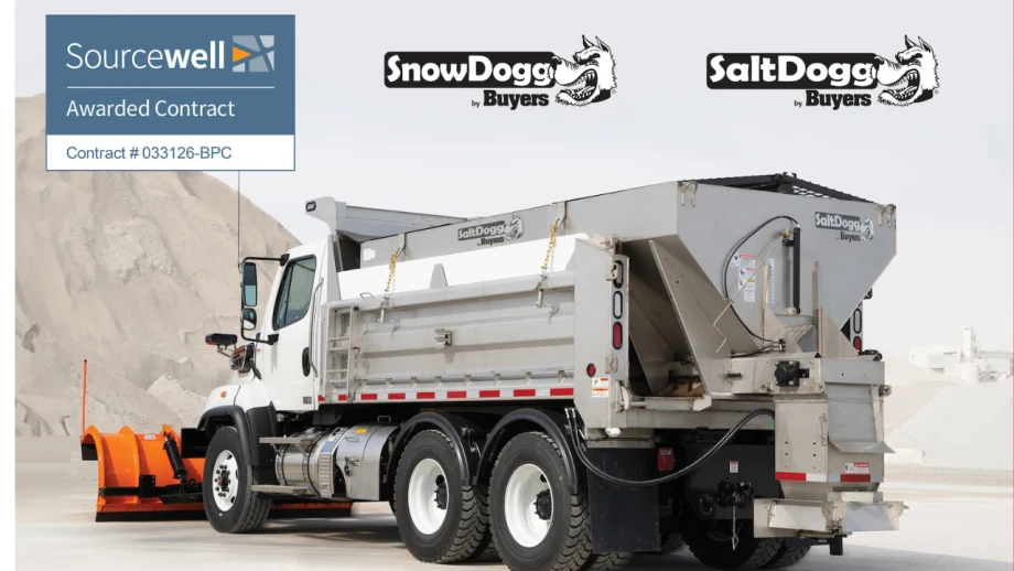 White dump truck equipped with SnowDogg snowplow and SaltDogg spreader at a salt facility, featuring Buyers Products branding and a Sourcewell-awarded contract graphic.