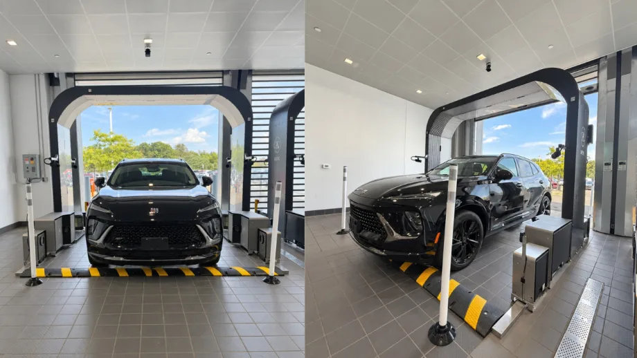 Black SUV positioned inside a UVeye drive-through inspection lane equipped with cameras and scanning hardware at a LaFontaine dealership in Michigan.