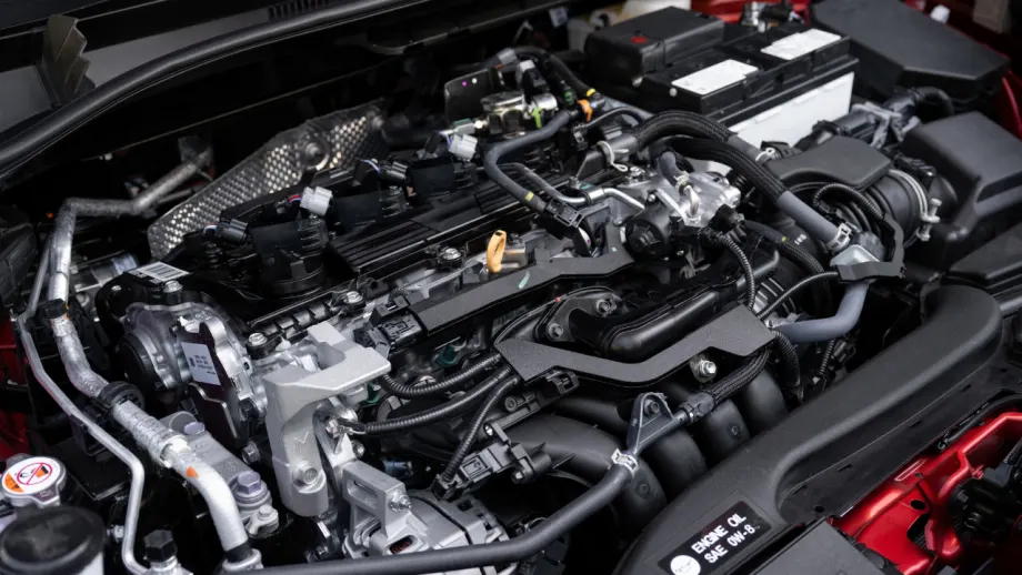 Engine compartment of a gas-powered 2027 Toyota Corolla Cross showing its 2.0L four-cylinder engine.