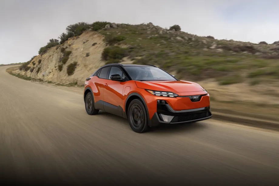 A 2027 red subaru uncharted drives down a road
