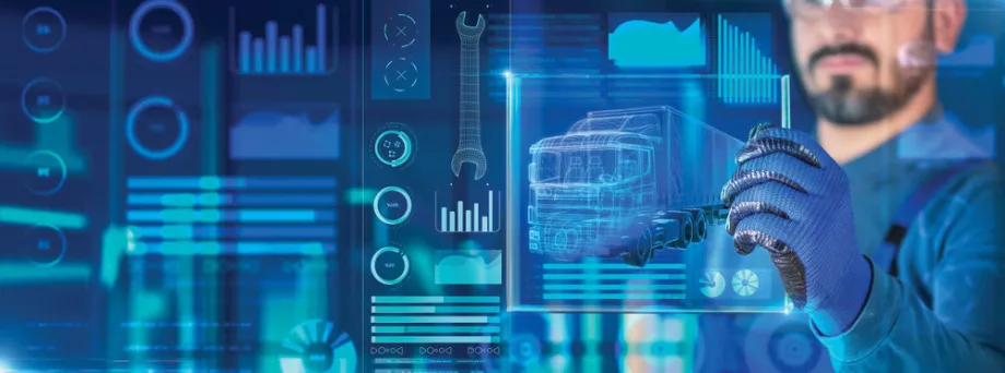 Blue page with a man holding a high tech screen that shows a truck