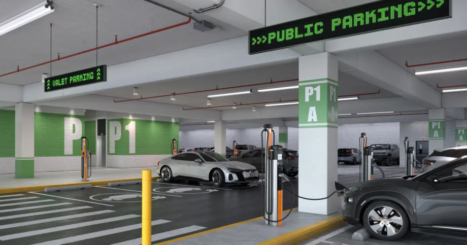 EVs charging along a row of fast chargers in an underground parking deck.