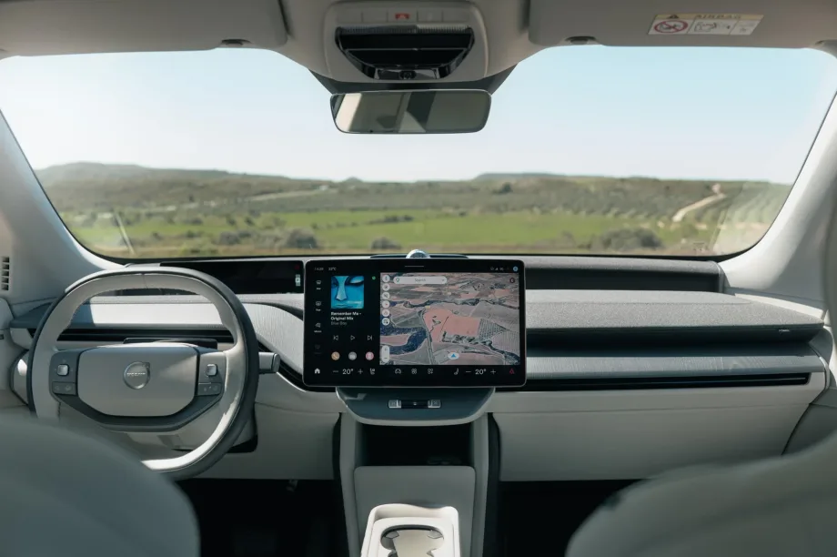Interior dashboard view of a Volvo EV featuring Google Maps navigation and infotainment display during a demo of upcoming Gemini AI vehicle integration.