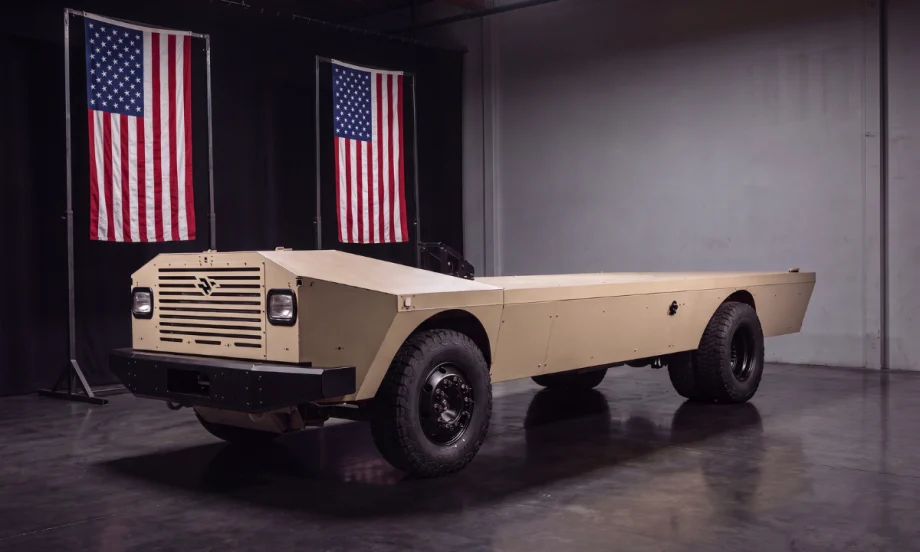 A cream-colored flat vehicle platform that looks like the bottom half of a truck.