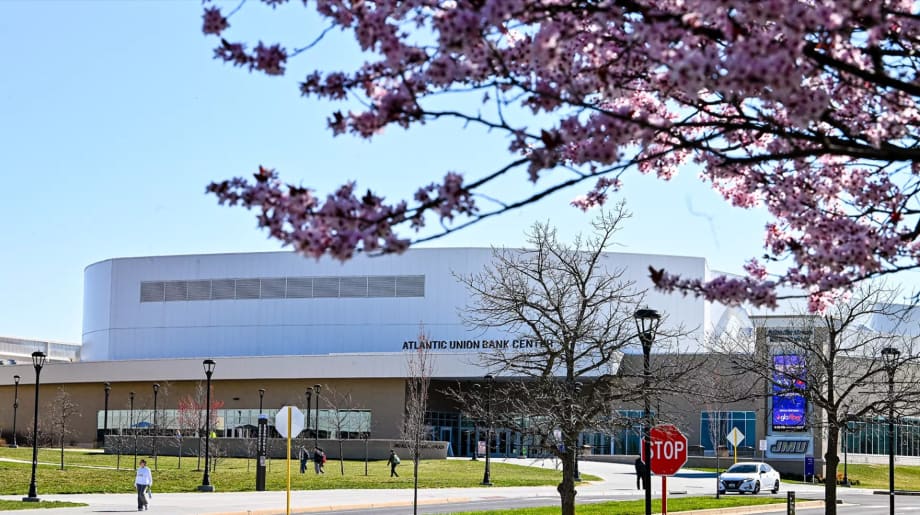 Cherry blossoms frame James Madison University's Atlantic Union Bank Center in Harrisonburg, Virginia, host site for the Mid-Atlantic Advanced Transportation Summit & Expo (MAATSE).